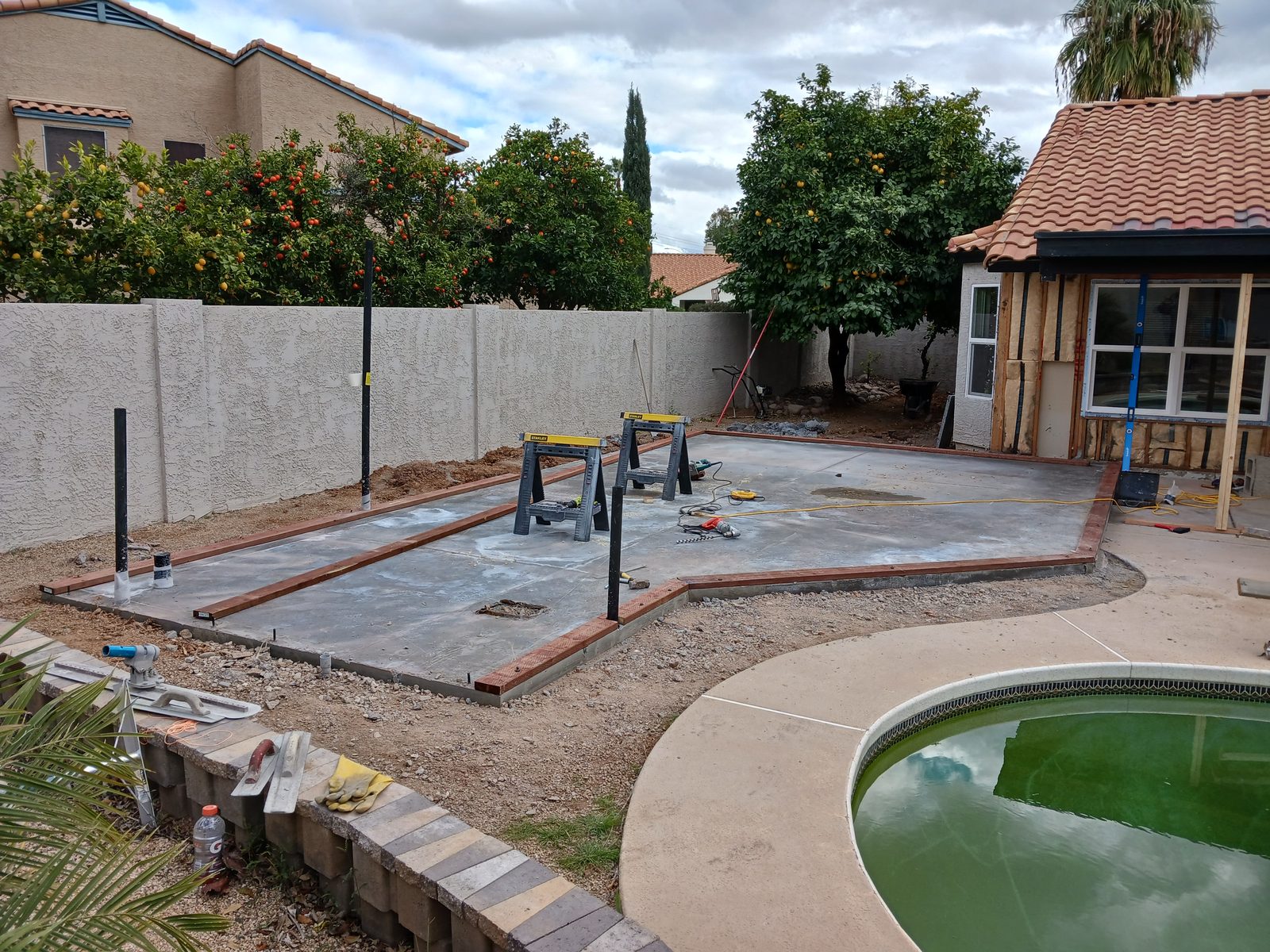 Backyard concrete slab and patio construction
