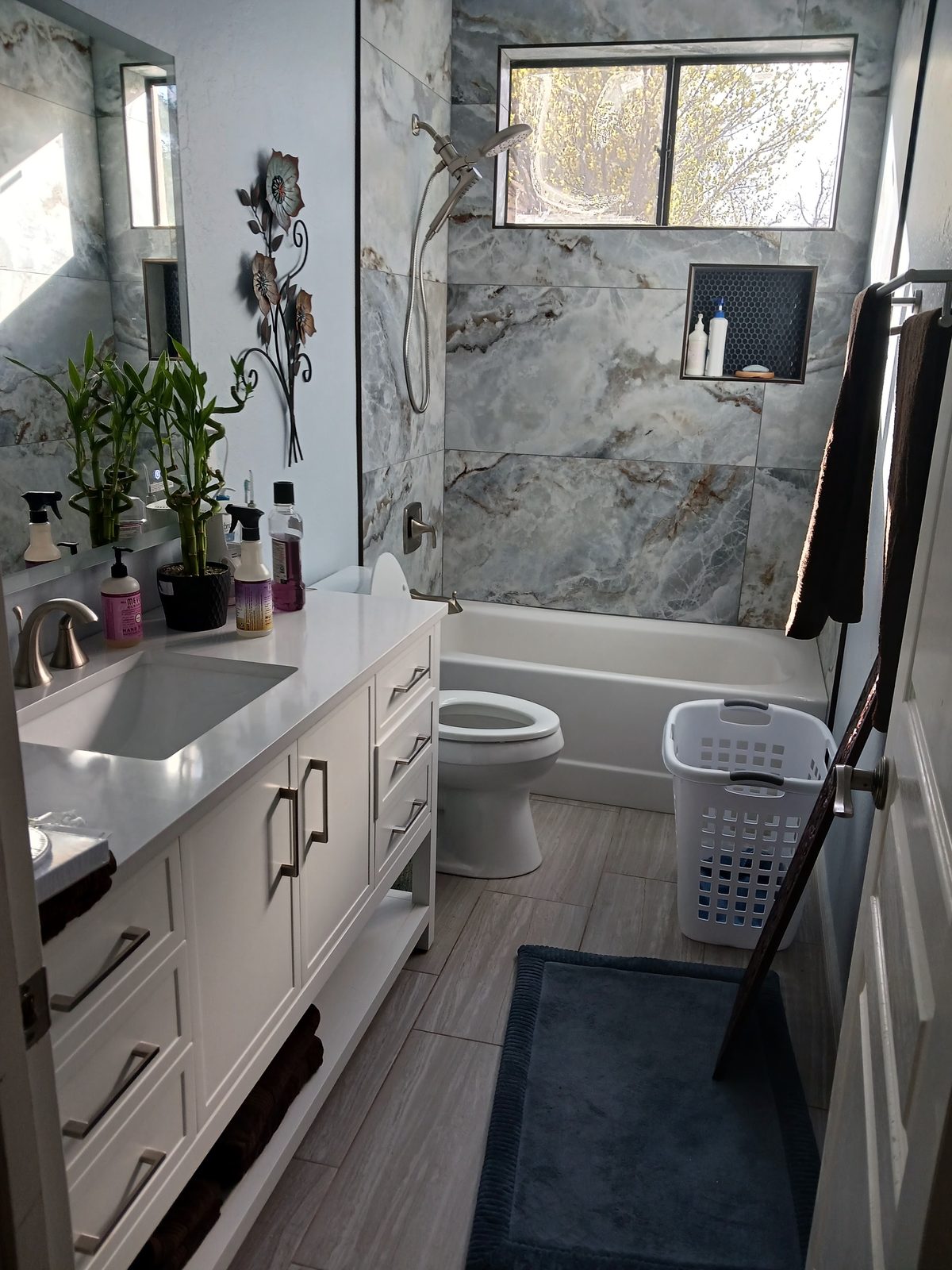 Marble-tile bathroom remodel with custom vanity