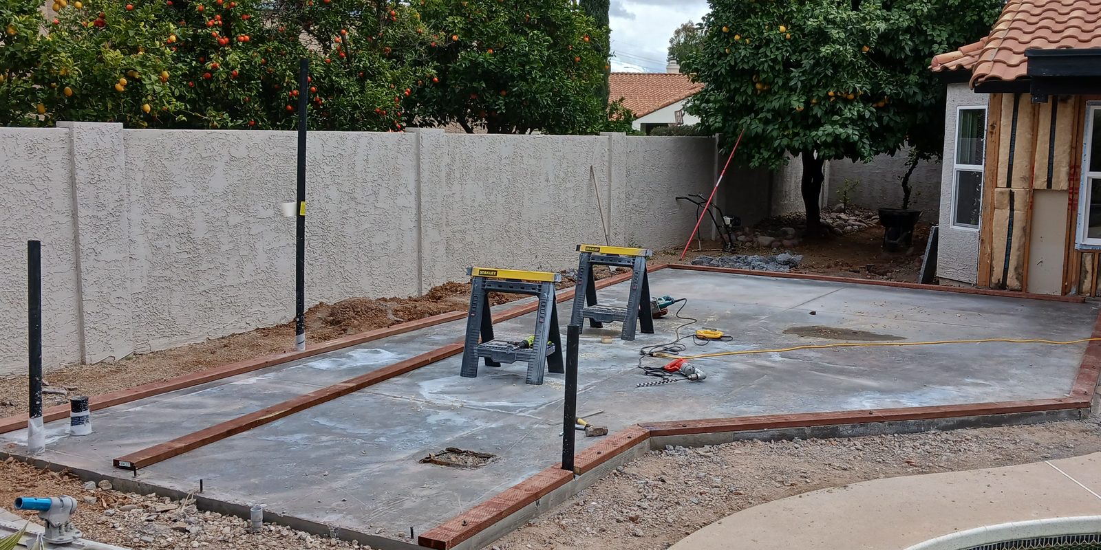 New backyard concrete slab with formed edges